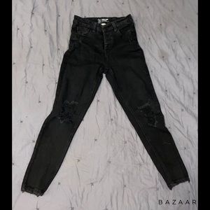Black holy skinny jeans